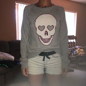 Grey sweater with skull with heart eyes